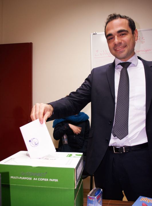 Association elections: a member puts their ballot paper in the ballot box